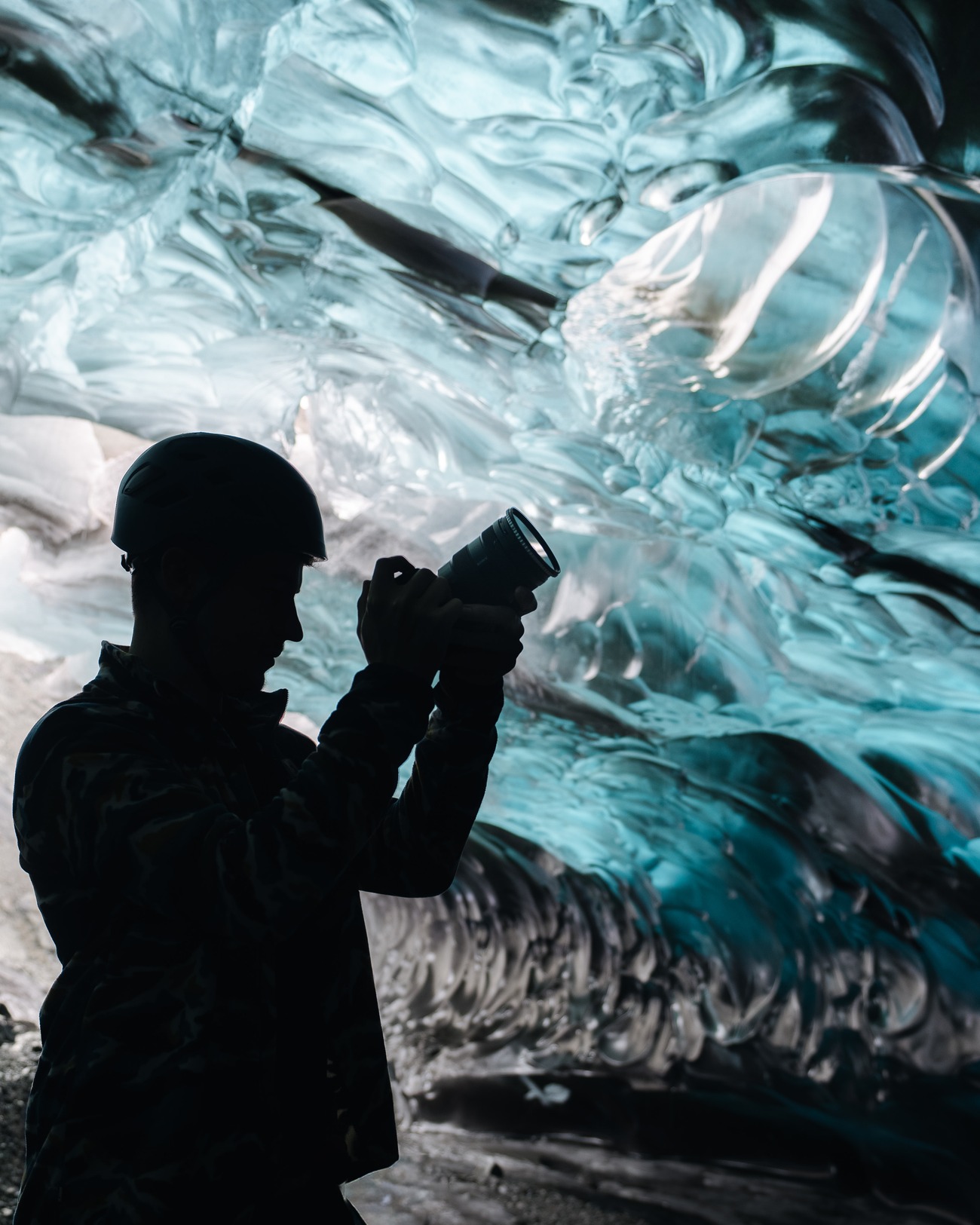 Photographer inside an ice cave, Iceland — MPB Everfind
